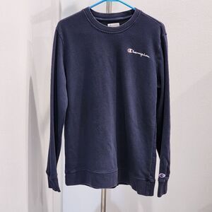 Champion's blue sweater